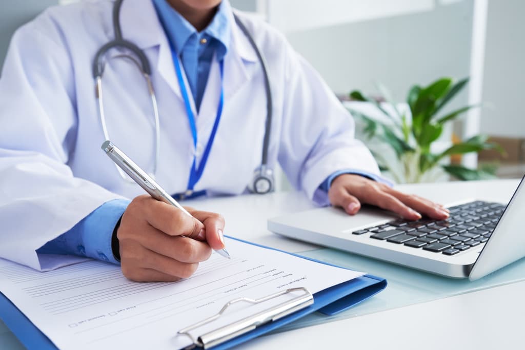 Doctor working on laptop